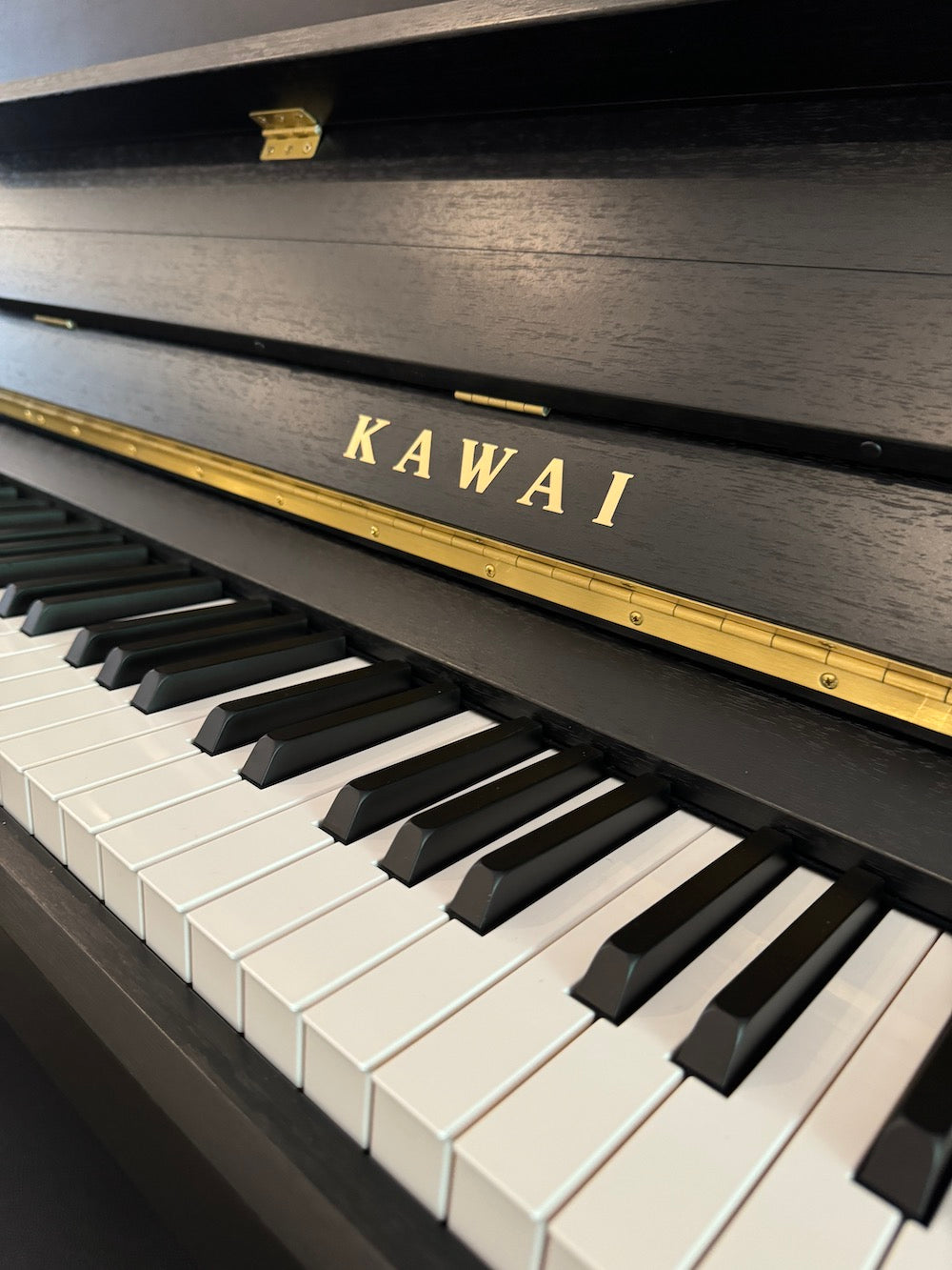 The new Kawai E-300 upright. A piano for the times.